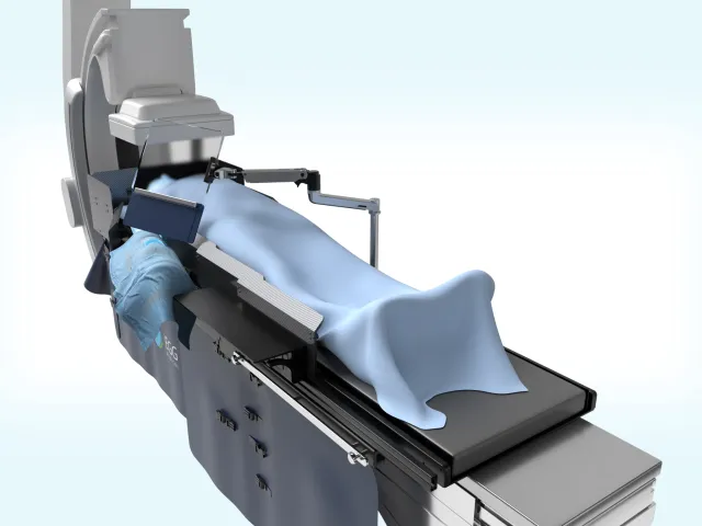 Render of EggNest Protect 2.0 on a procedure table: shields along the table rails and a shielded skirt to the floor