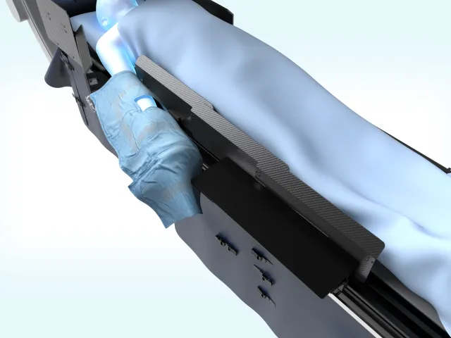 Render of ScatterPro over the patient's arm for radial access, beside the EggNest table shields